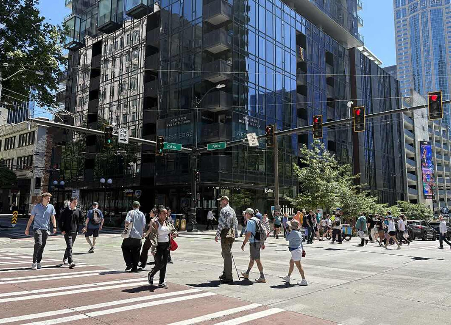 Pedestrians use crosswalk on 2nd Ave in downtown Seattle.